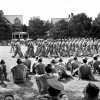 <p>Marching in formation on the Parade Ground during a graduation ceremony. Looking west at Officers&#39; Row (Buildings 9 and 10), September 1942.</p>